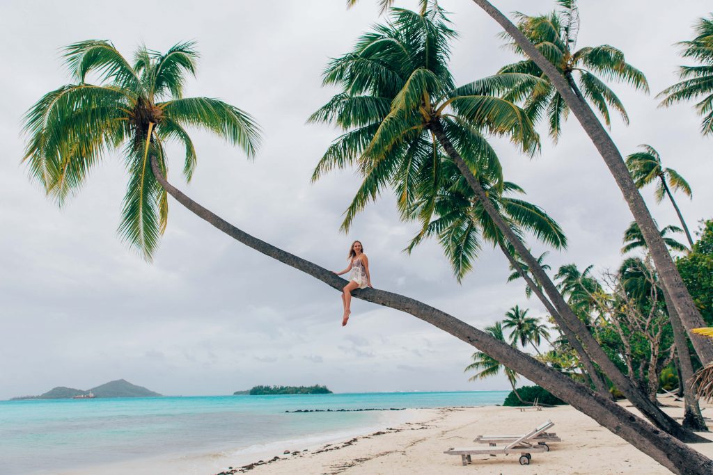 Holiday in Tahiti- Girl in palm tree in Bora Bora